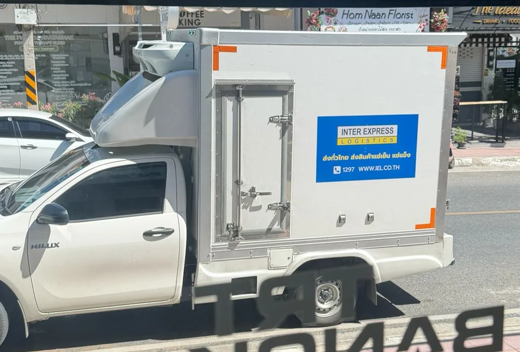 Inter Express Logistics refrigerated cold-chain truck at the TRT Bangkok clinic, collecting Mounjaro shipments for nationwide delivery
