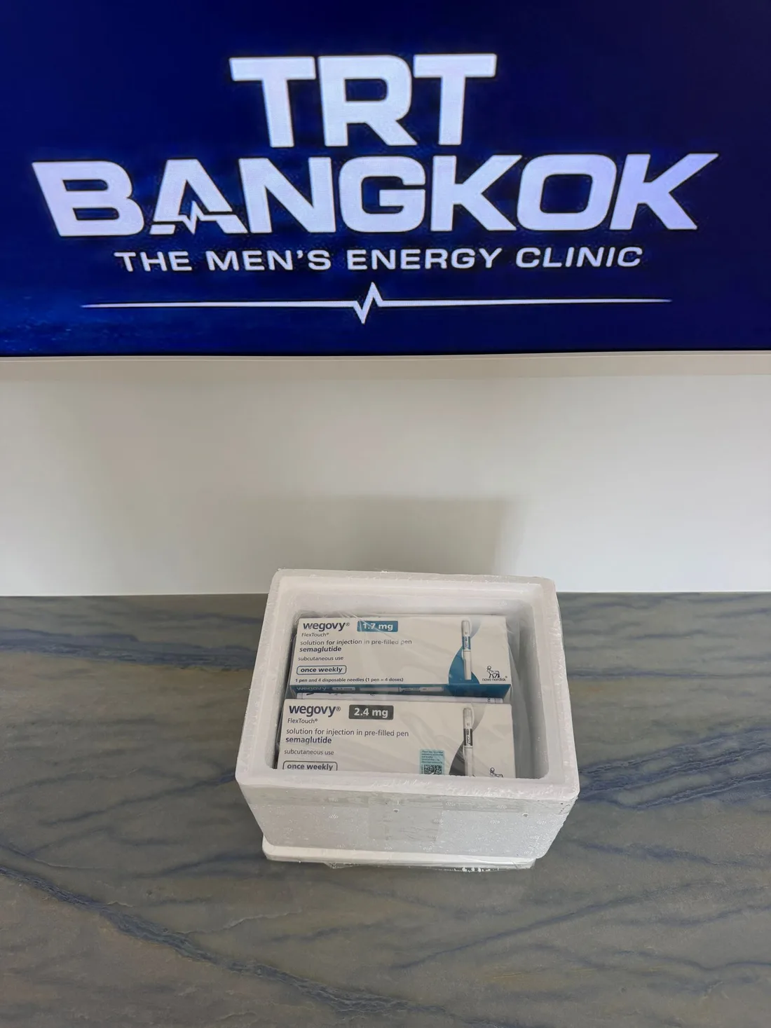 Authentic Wegovy semaglutide delivered in an insulated cold-chain box at TRT Bangkok Clinic reception, Pattaya